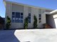 Juniperus Kaizuka  from the topiary  different  range  clipped as narrow  columns, and are now  feature plants in front of narrow walls in the front of this new modern home