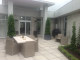 Topiary columns in pots make stunning feature plants on either side of this entranceway leading to the outdoor patio area.