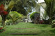 A birdbath at the end of the lawn helps to draw your eyes down the full length of the garden