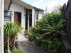 An inviting front entranceway with a mixture of foliage and form